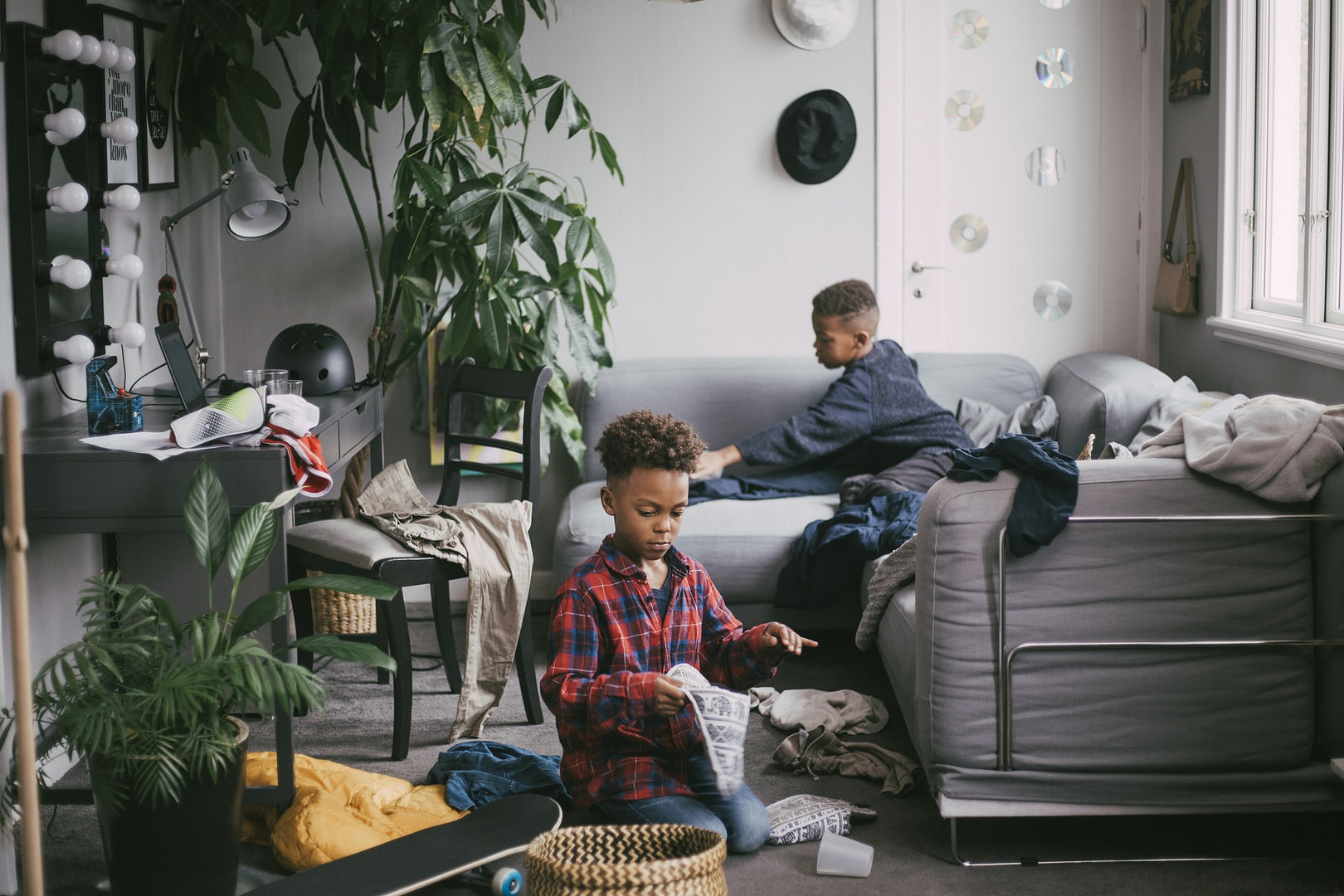 Children cleaning a messy room