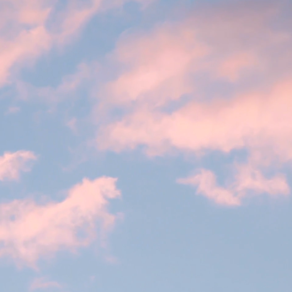 Pink clouds on a blue sky